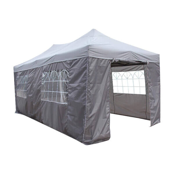 Side angle photo of a grey 6m x 3m gazebo with grey sides. Sides displaying clear window panel on the two side and a rolled up door on the front panel.