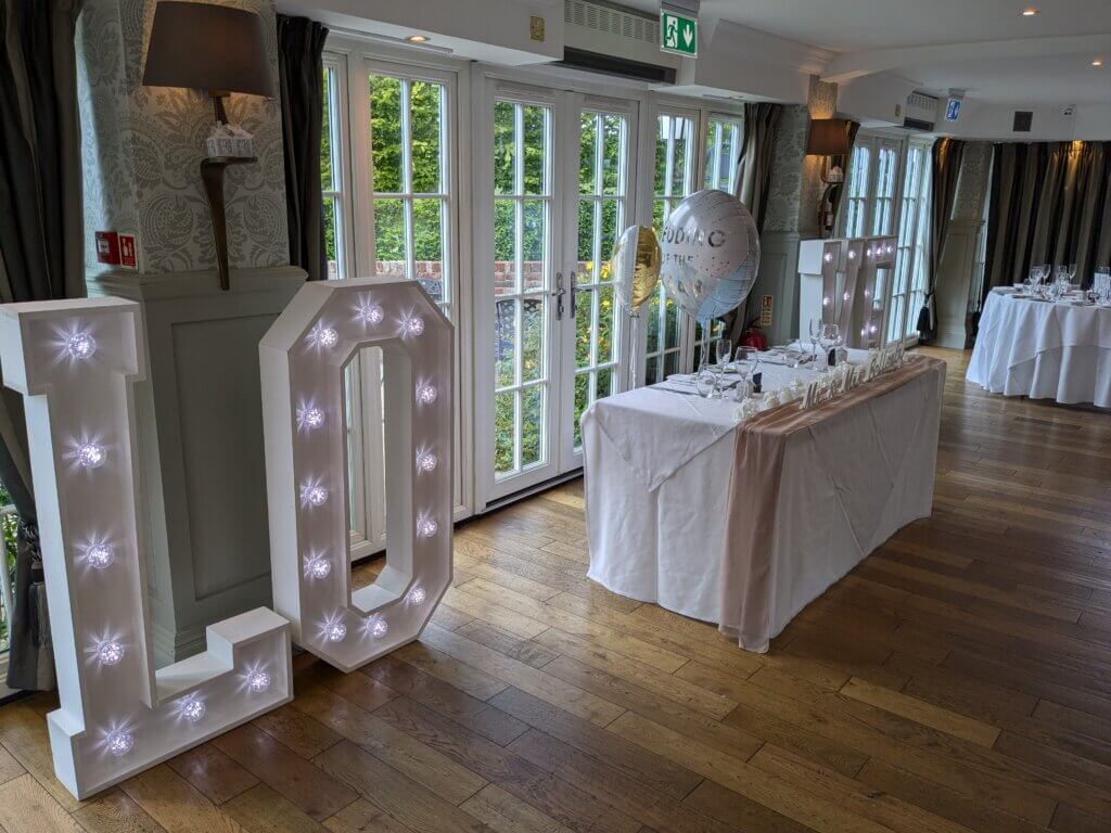 4ft marquee LOVE letters either side of the head table at the Old Thorns Hotel.