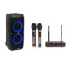 JBL Partybox 310 party speaker with blue LED lights showing and two wireless microphones with colour coded bases, next to the microphone receiver