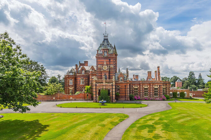 The Elvetham Hotel in Hartley Wintney, Hampshire. Gorgeous green grass and a circular driveway up to the main entrance.