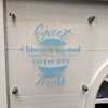 Custom sweet cart sign in baby blue with a wedding couples' names, as well as their wedding date. On clear acrylic and mounted to sweet cart